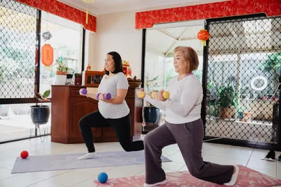 Image of mother and daughter doing home exercises.