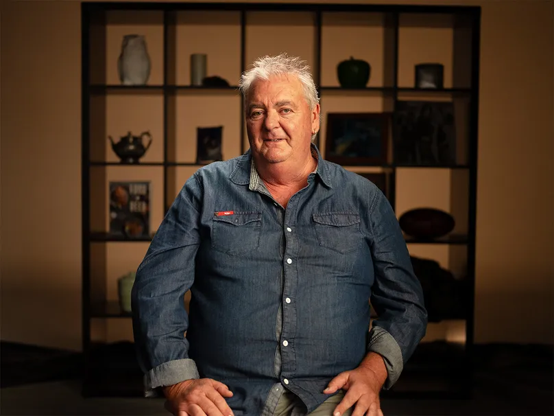 Portraits of Barrie smiling.