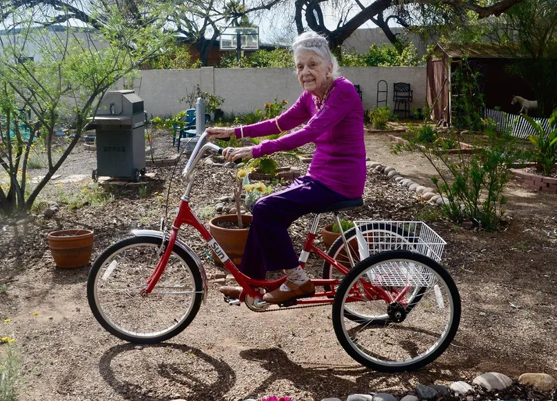 Image of Dr Gladys on her tricycle 