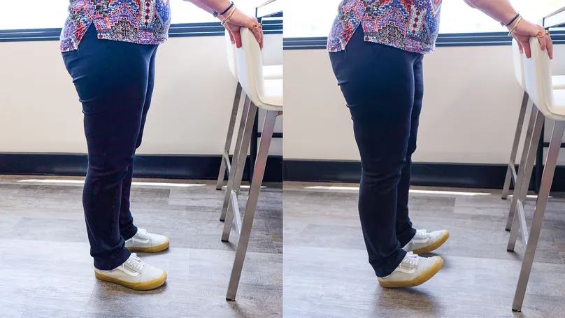 A woman doing the toe raise exercise.