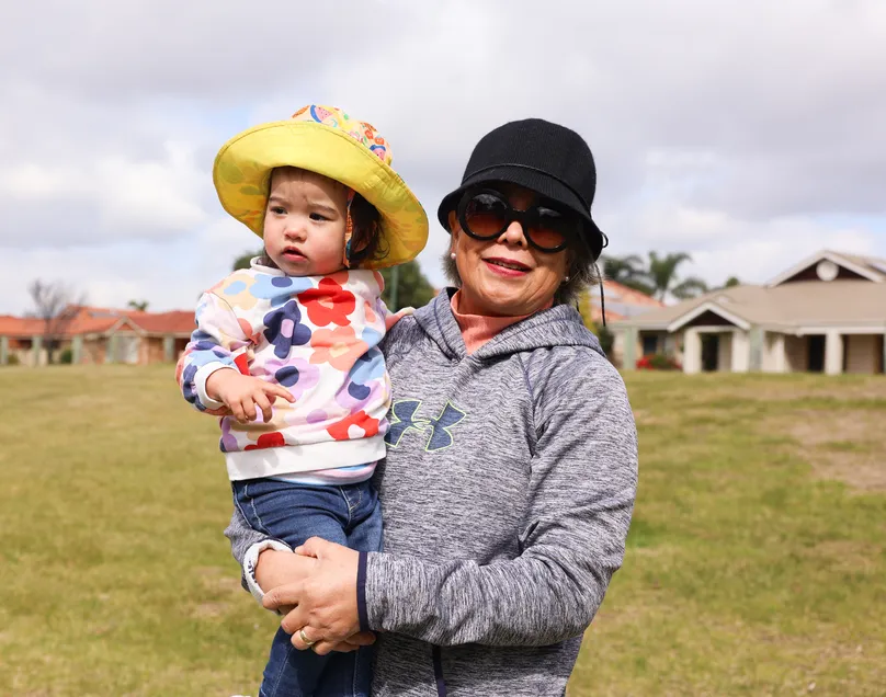 Grandmum and grandaughter outside