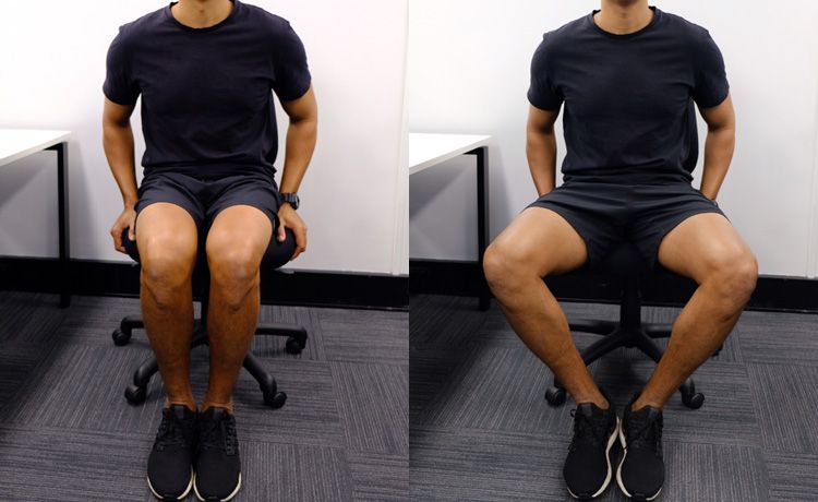 A man sitting in a chair doing the hip opener exercise.