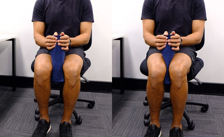 A man sitting in a chair doing the hip squeeze exercise.