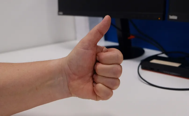 A hand making a full fist.