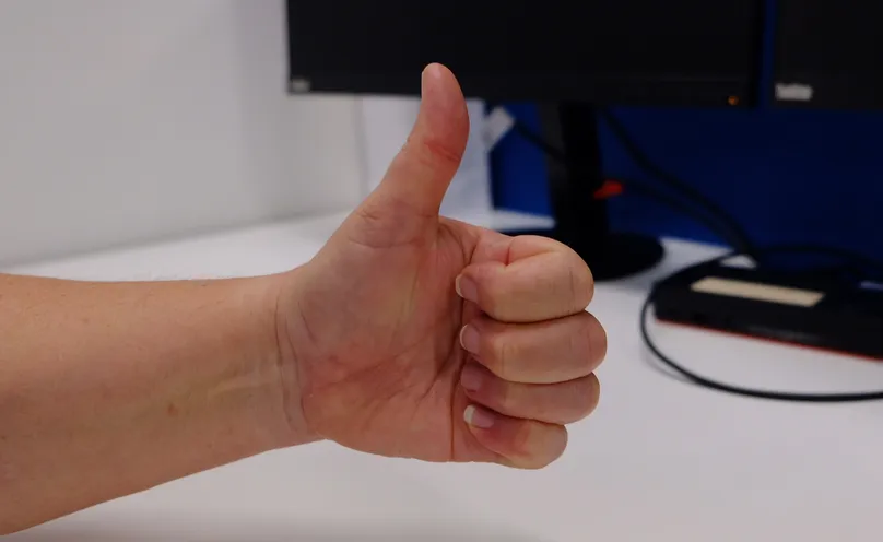 A hand making a hook fist.