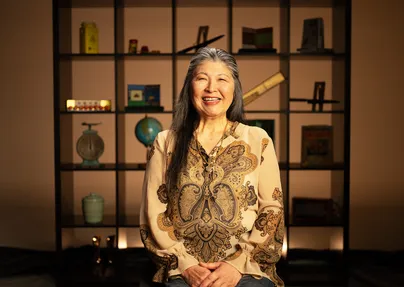 Portrait of Mami smiling.