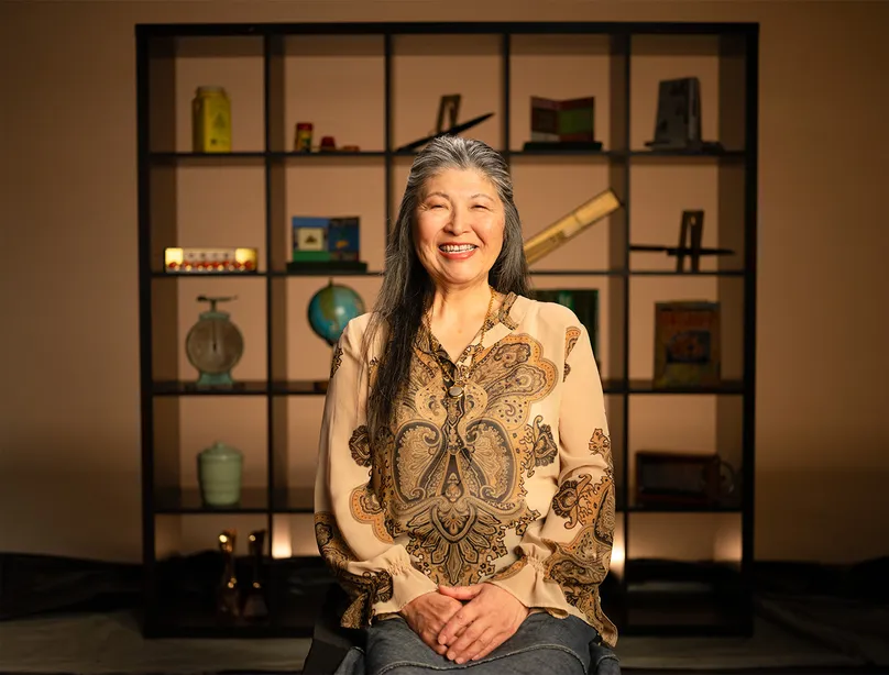 Portrait of Mami smiling.