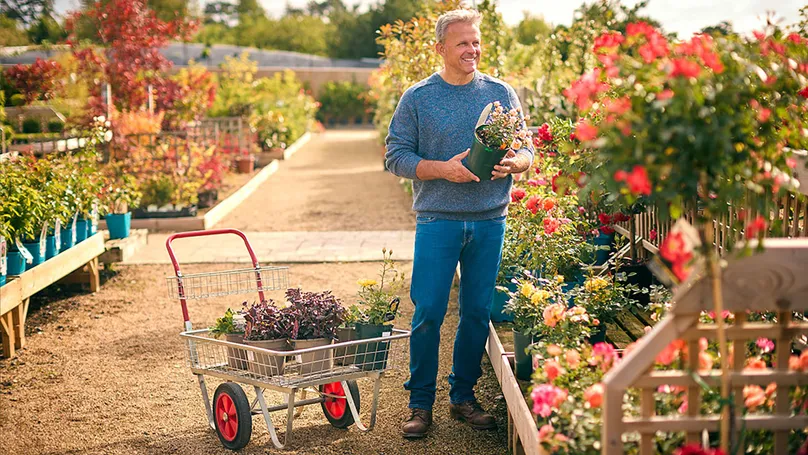 A man using a garden trolley.