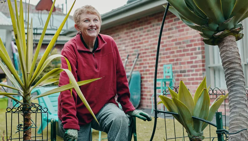 Image of woman working in the garden.