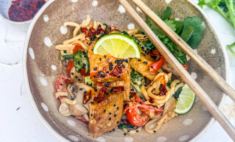 A bowl of delicious peanut tofu dish.