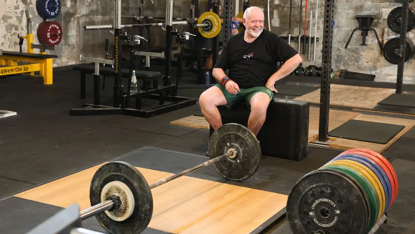 Paul Kerin sitting at the gym.