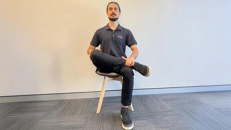 Image of man doing seated pigeon