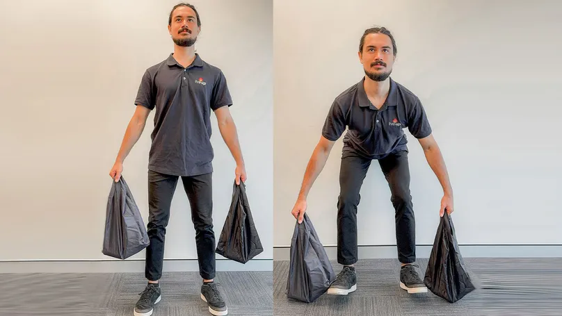 A man doing deadlifts with shopping bags.