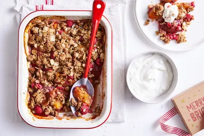 A festive image of a summer fruits crumble.