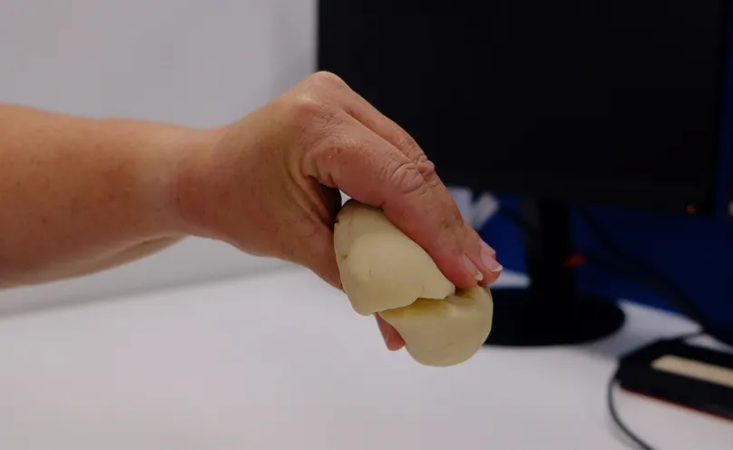 A hand doing the pinch exercise with all fingers.