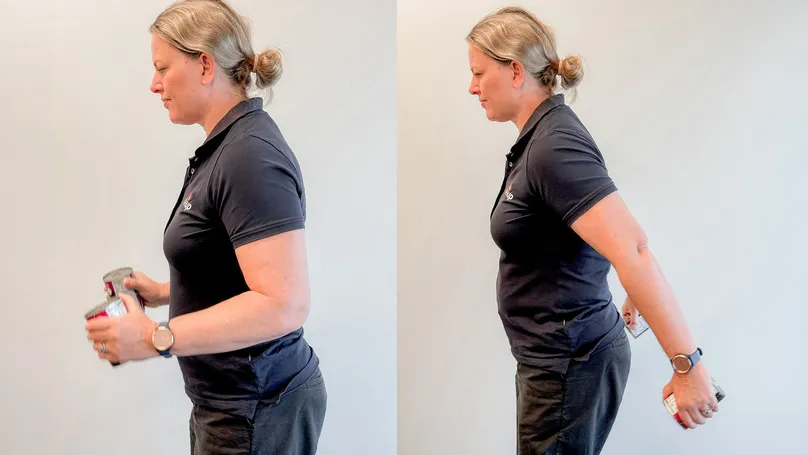 A woman doing triceps kickbacks with cans as weights.