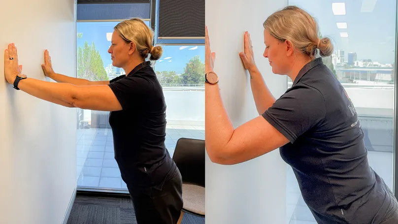 Image of woman doing wall push ups