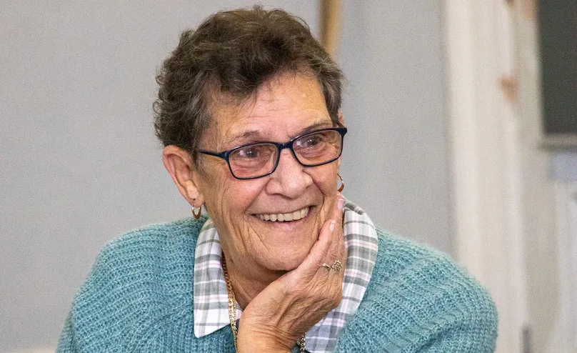 Image of a woman smiling.