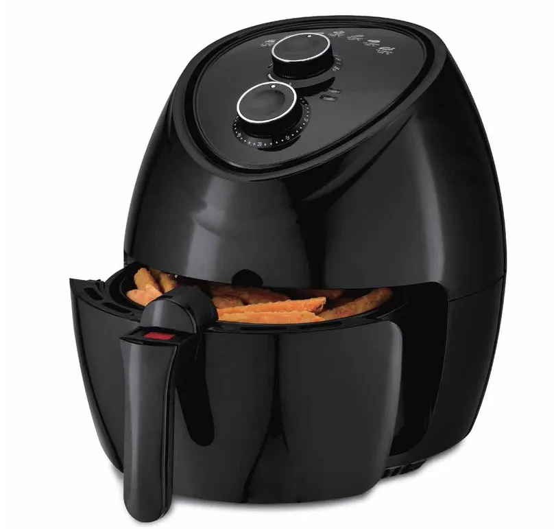 An air fryer with the drawer open.