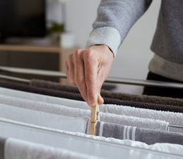 Hanging the laundry out on an inside washing line.