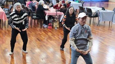 older people doing tai chi class