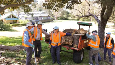 Men volunteers relaxing at the golf club